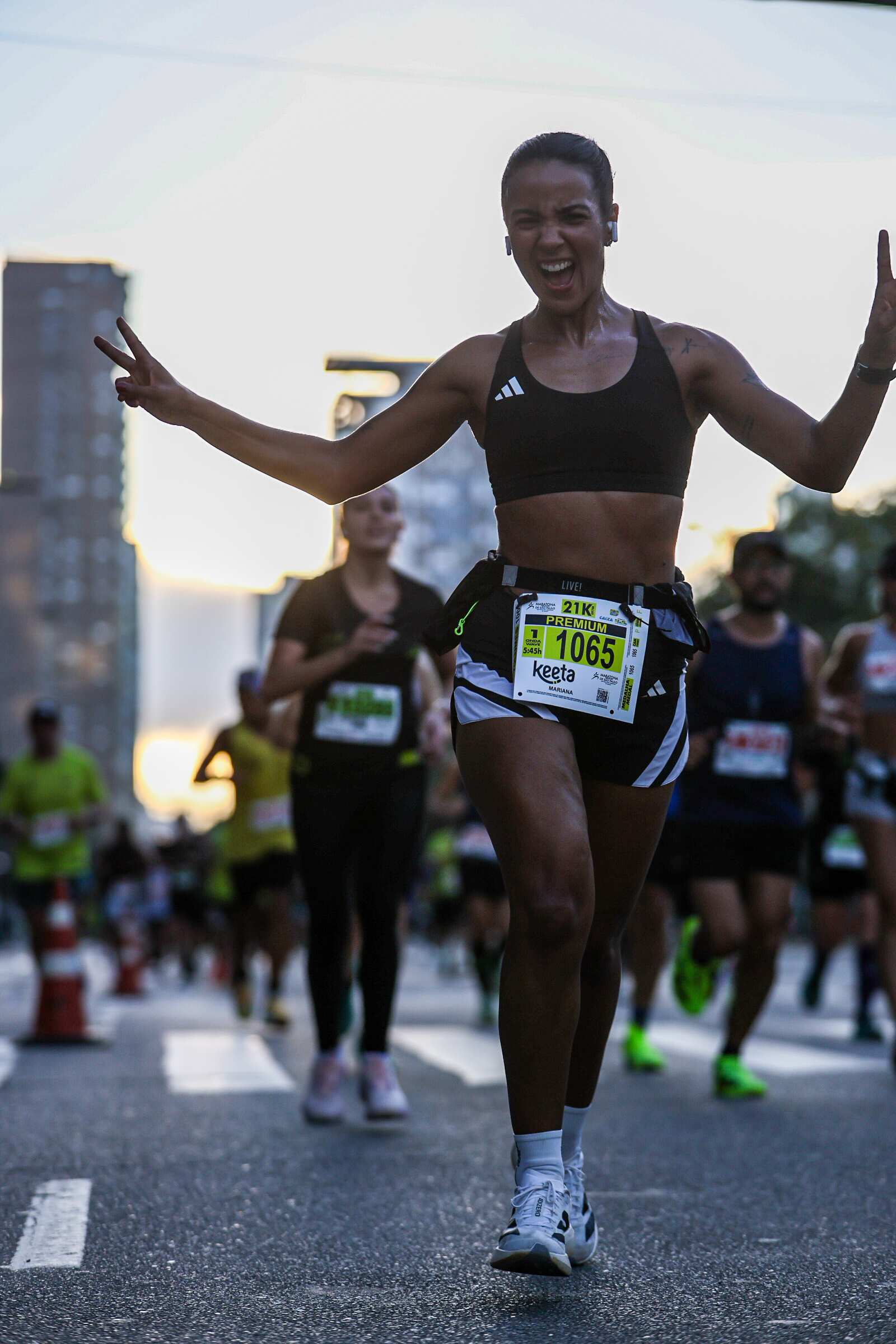 Mari at the finish line of a half marathon in São Paulo