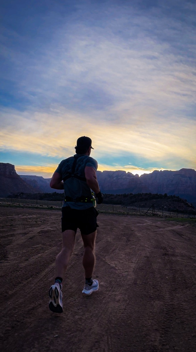 Trevor running into the sunset above Virgin, Utah